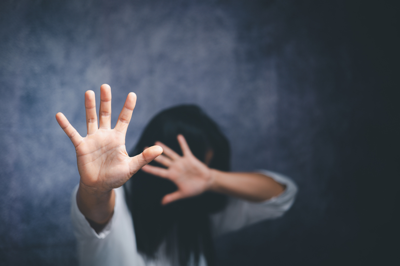 Stop violence against Women, international women's day. Young depressed woman, domestic and rape violence,beaten and raped sitting in the corner.